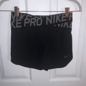 Nike pros with crossed waistband